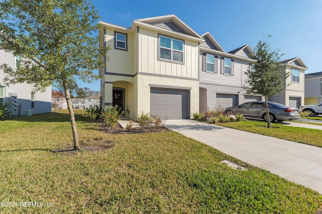 view of front of home with a garage and a front lawn