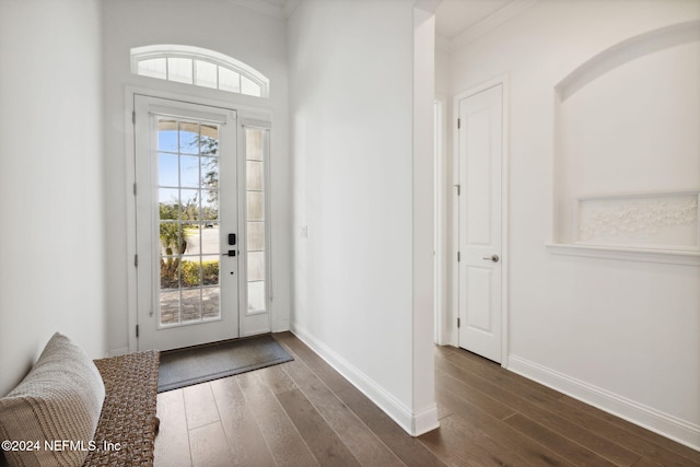 foyer with dark hardwood / wood-style flooring and ornamental molding