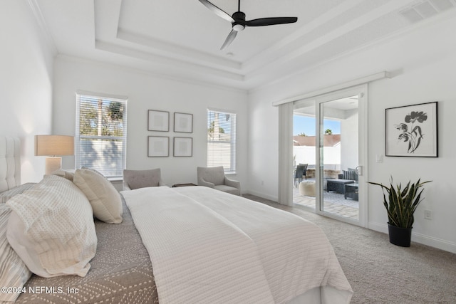 bedroom featuring access to exterior, ceiling fan, a raised ceiling, light colored carpet, and ornamental molding