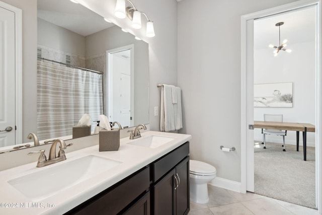 bathroom with a notable chandelier, tile patterned floors, toilet, vanity, and a shower with shower curtain