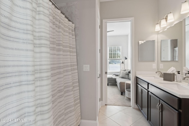 bathroom with tile patterned flooring, vanity, and a shower with shower curtain