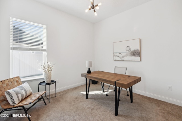 carpeted home office with a notable chandelier