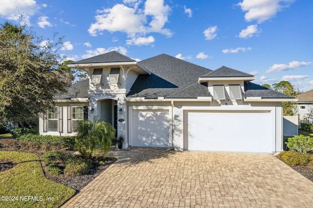 96072 Ocean Breeze Dr, Fernandina Beach, FL 32034 - view of front facade featuring an attached garage, decorative driveway, and a shingled roof
