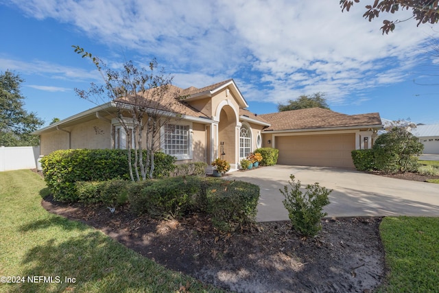 view of front of property with a garage