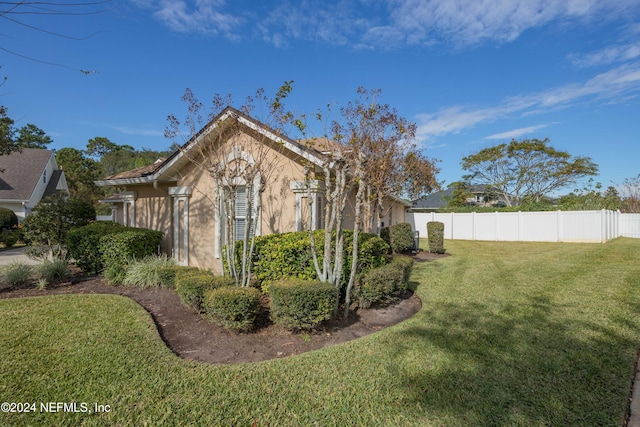 view of home's exterior featuring a yard