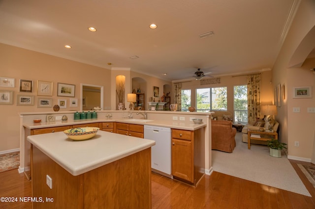 kitchen featuring dishwasher, light hardwood / wood-style floors, a kitchen island, and ceiling fan