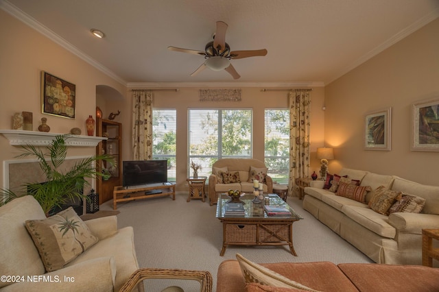 living room featuring carpet, crown molding, and ceiling fan