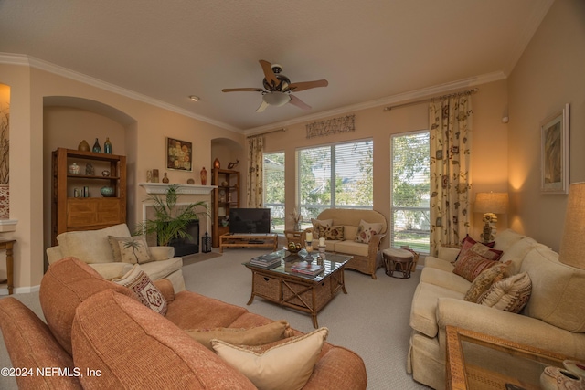 living room featuring ceiling fan, light colored carpet, and ornamental molding