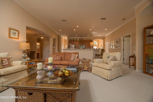 carpeted living room with ornamental molding