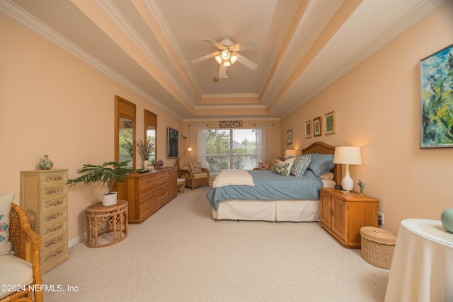 bedroom featuring a raised ceiling, ceiling fan, crown molding, and light colored carpet