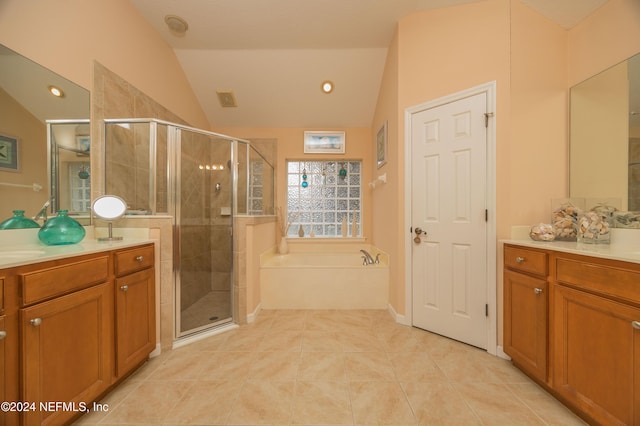 bathroom featuring separate shower and tub, tile patterned floors, vanity, and vaulted ceiling