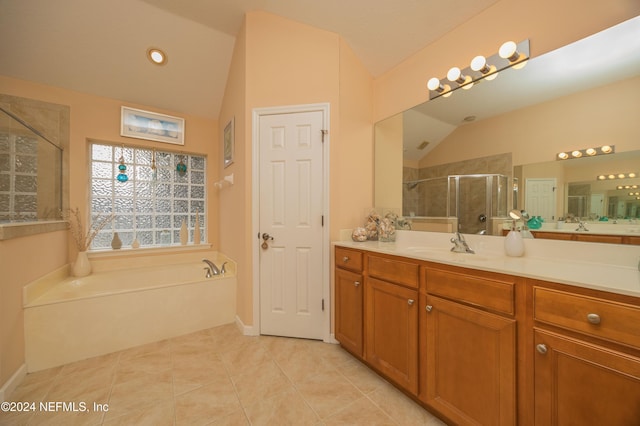 bathroom featuring tile patterned flooring, vanity, independent shower and bath, and lofted ceiling