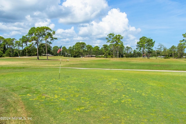 surrounding community featuring a lawn