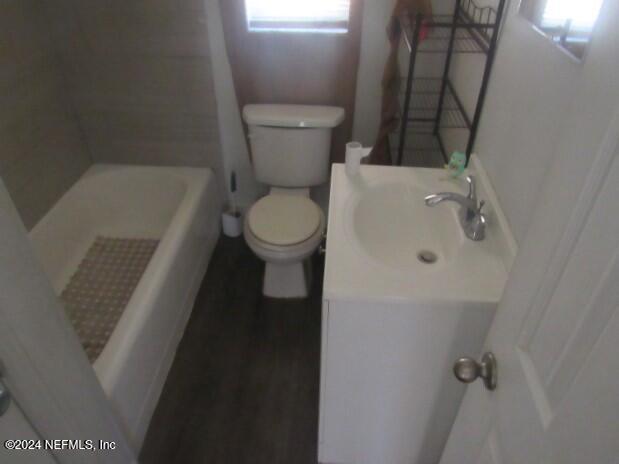 bathroom with vanity and toilet