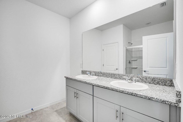 bathroom featuring vanity and walk in shower