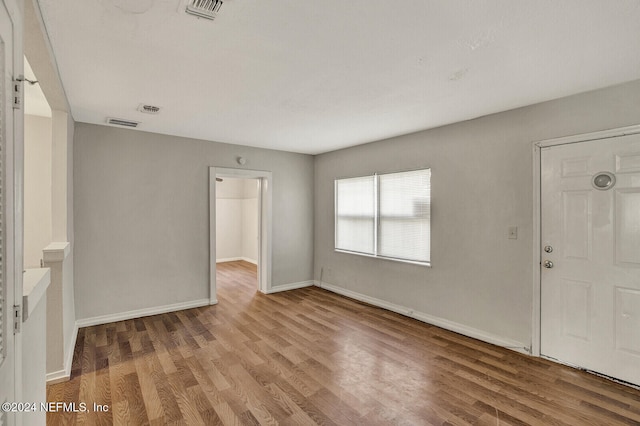 entryway with hardwood / wood-style flooring