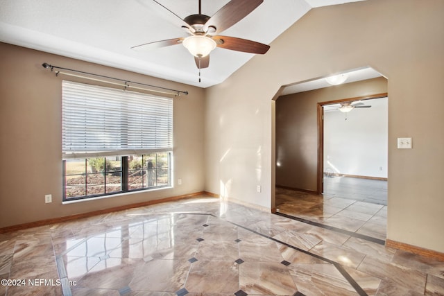 unfurnished room featuring ceiling fan and lofted ceiling