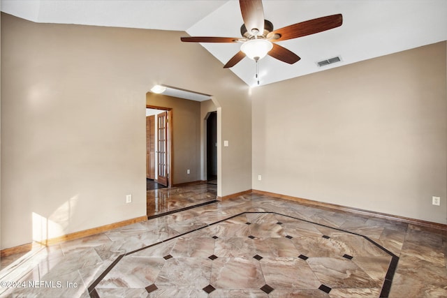 spare room with ceiling fan and vaulted ceiling