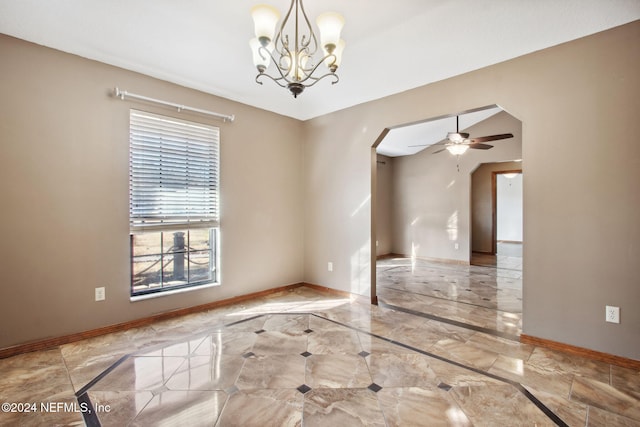 spare room with ceiling fan with notable chandelier