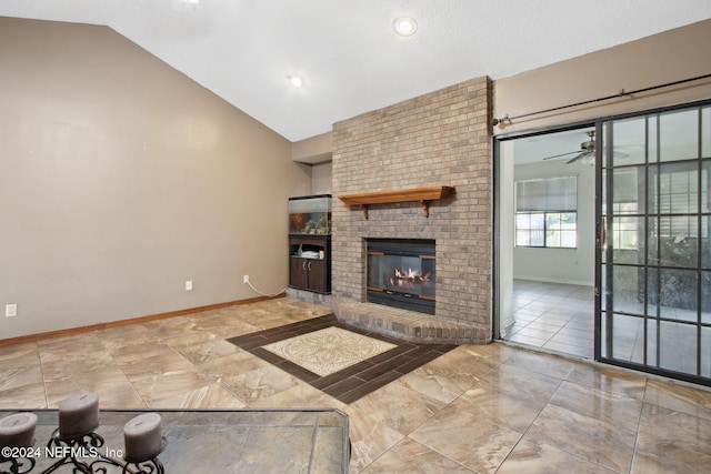 living room with ceiling fan, a fireplace, and lofted ceiling