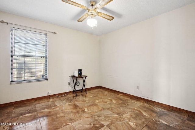 empty room featuring ceiling fan