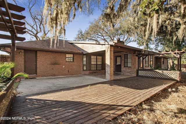 wooden terrace featuring a patio