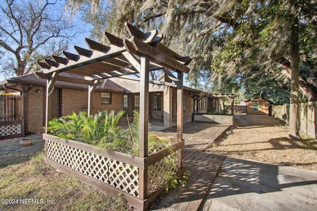 exterior space featuring a shed, a pergola, and a patio