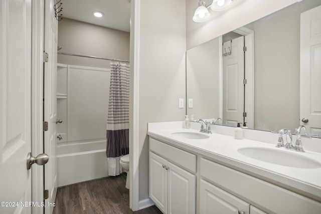 full bathroom with vanity, toilet, shower / bath combination with curtain, and wood-type flooring