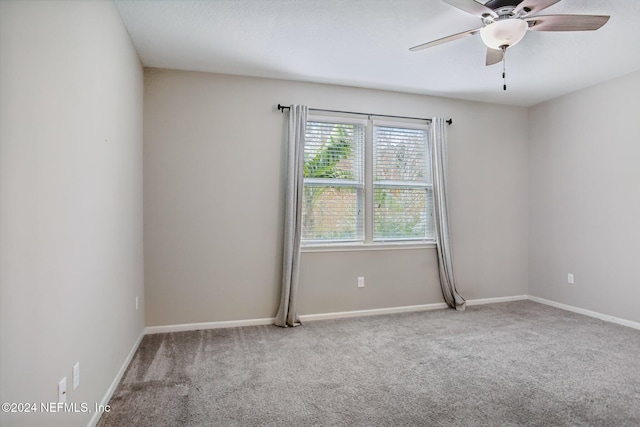 spare room with ceiling fan and carpet flooring