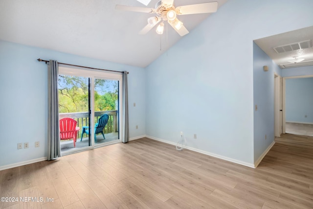 unfurnished room with ceiling fan, lofted ceiling, and light wood-type flooring