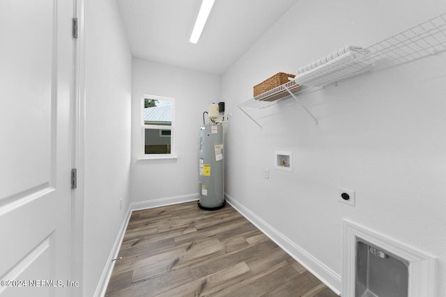 clothes washing area with electric dryer hookup, hookup for a washing machine, electric water heater, and hardwood / wood-style floors