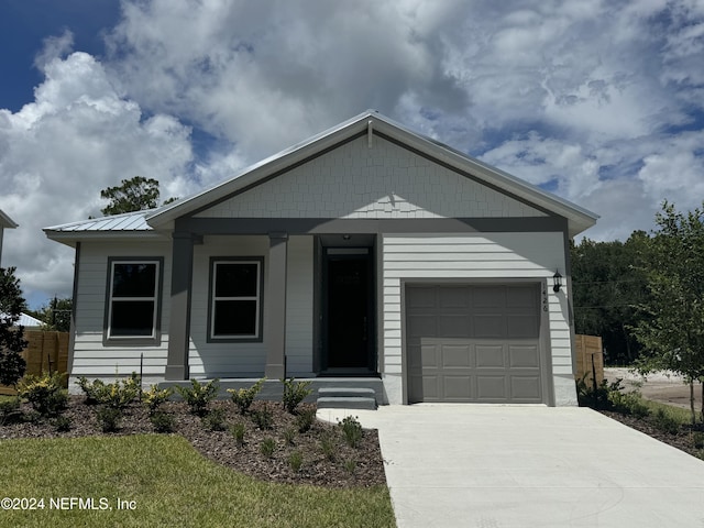 view of front of house with a porch and a garage