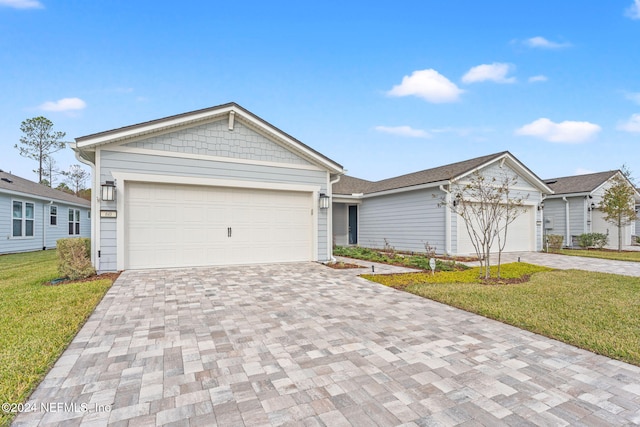 ranch-style house with a garage and a front lawn