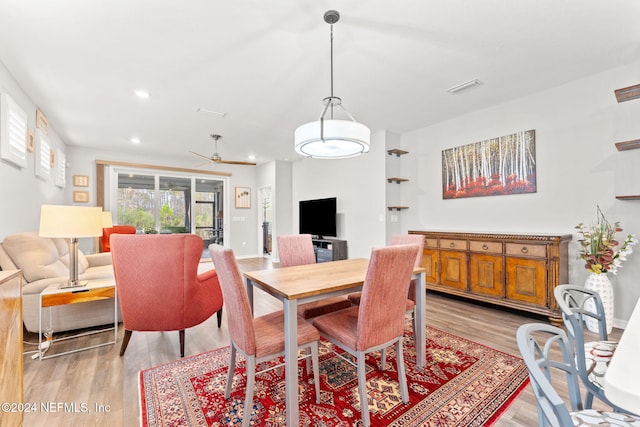 dining room featuring ceiling fan and light hardwood / wood-style floors