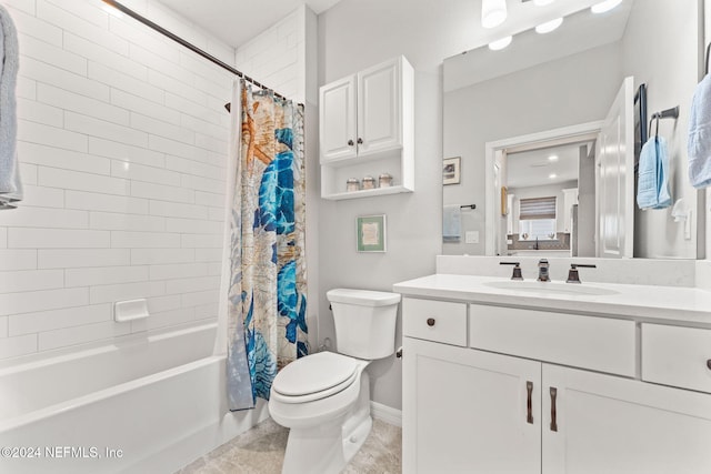 full bathroom with vanity, shower / bath combo, and toilet