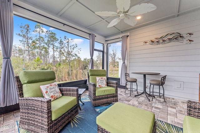 sunroom / solarium with ceiling fan