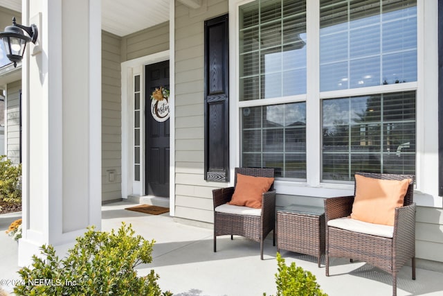 entrance to property featuring a porch