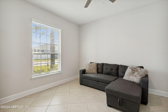 living area featuring ceiling fan and light tile patterned floors