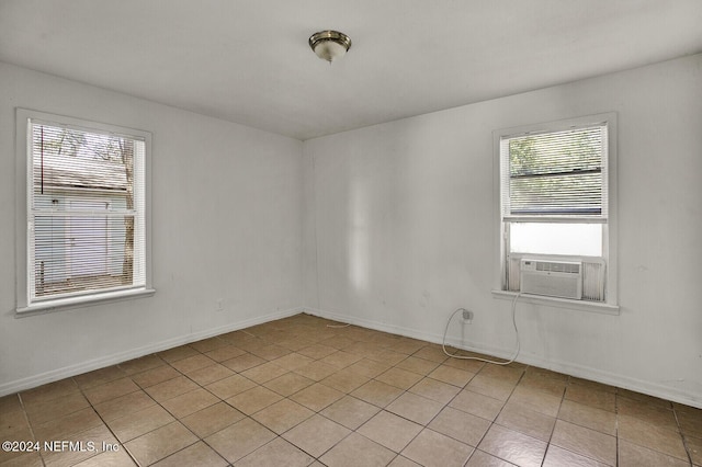 unfurnished room with light tile patterned floors