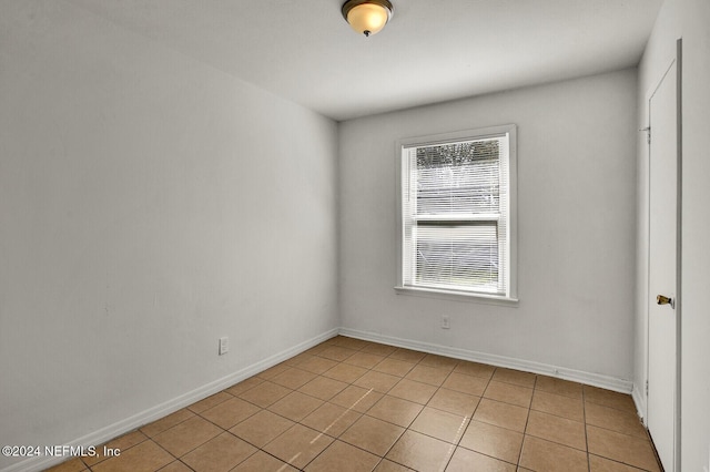 empty room featuring light tile patterned flooring