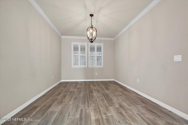 unfurnished room featuring wood-type flooring, ornamental molding, and a chandelier