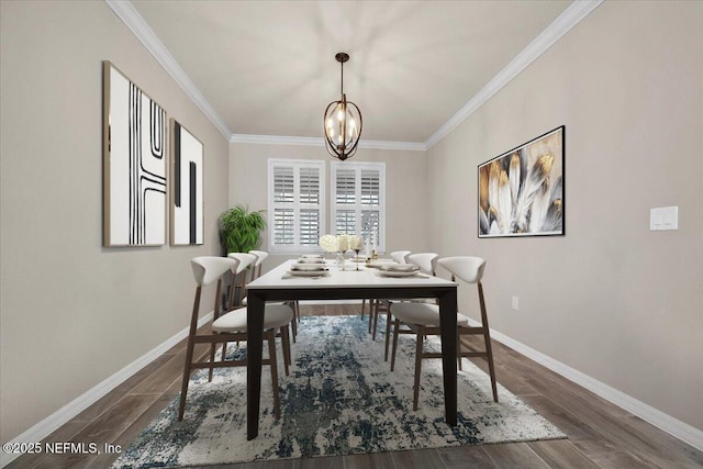 dining space featuring ornamental molding, dark wood-type flooring, and an inviting chandelier