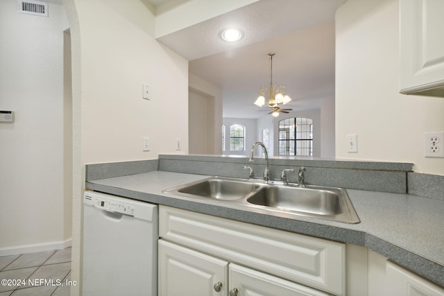 kitchen featuring sink, white dishwasher, decorative light fixtures, light tile patterned floors, and ceiling fan with notable chandelier