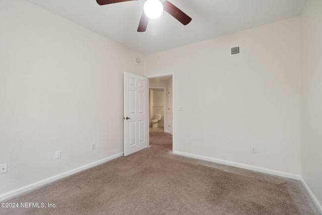 carpeted empty room with ceiling fan