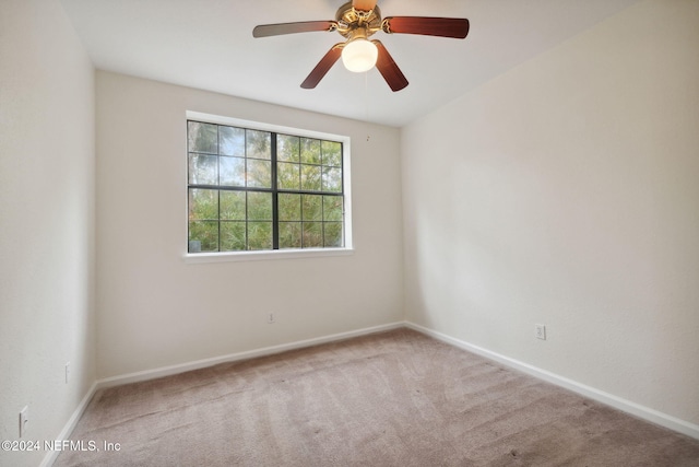 empty room with carpet floors and ceiling fan