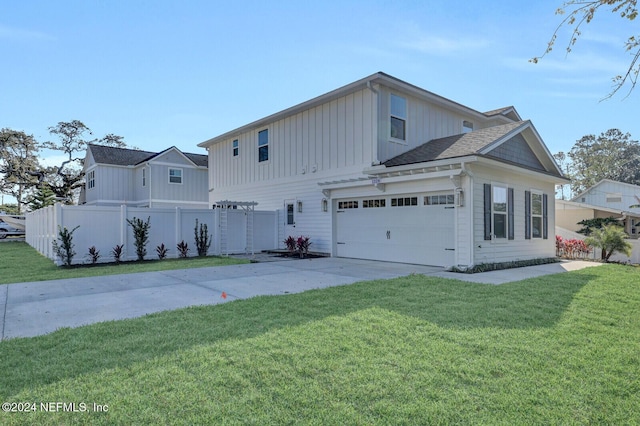 view of front facade with a garage and a front yard