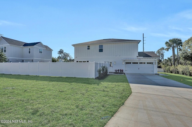 view of front facade with a front lawn and a garage