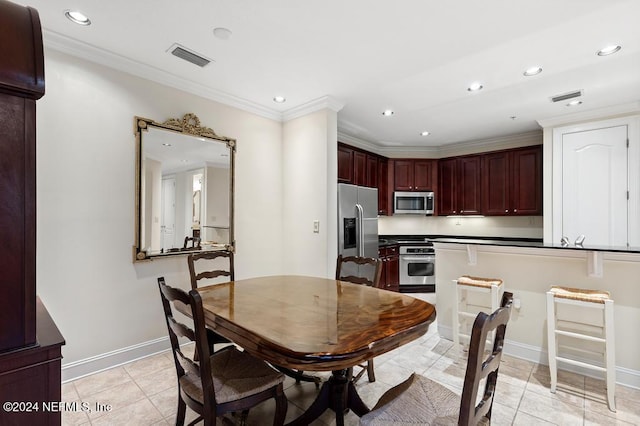 tiled dining area with ornamental molding