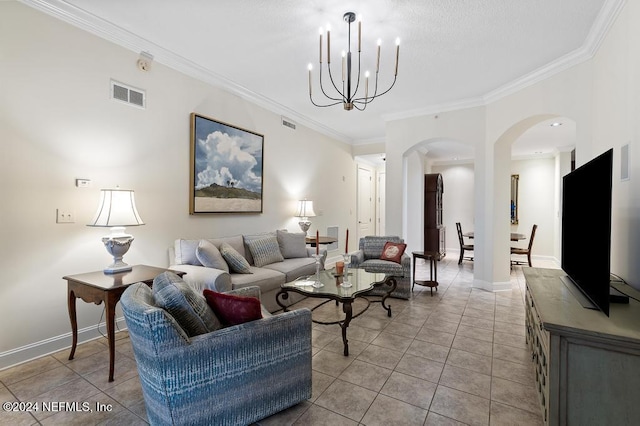 living room with light tile patterned flooring, ornamental molding, and a notable chandelier