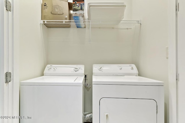 washroom with washer and dryer